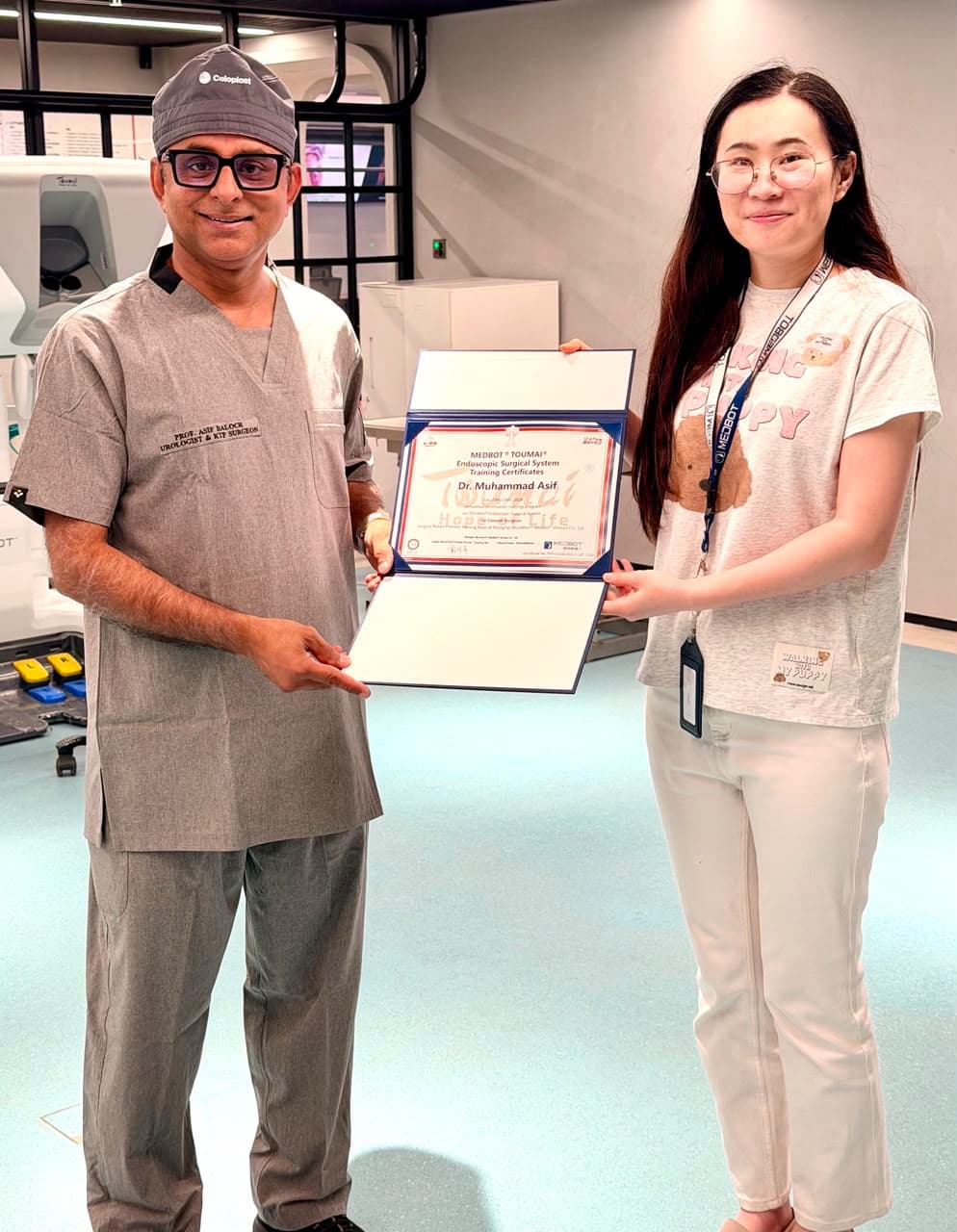 Prof. Dr. Asif Baloch receiving MEDBOT Toumai Endoscopic Surgical System Training Certificate as Console Surgeon